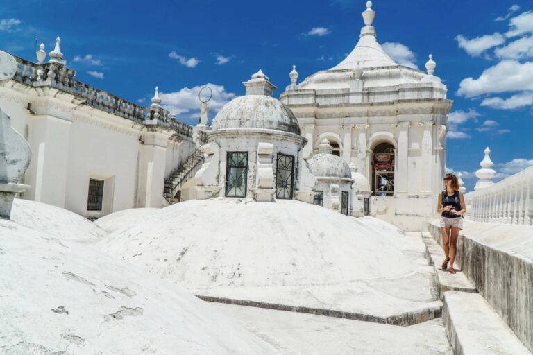Tourist visiting vibrant white cathedral in Leon, Nicaragua
