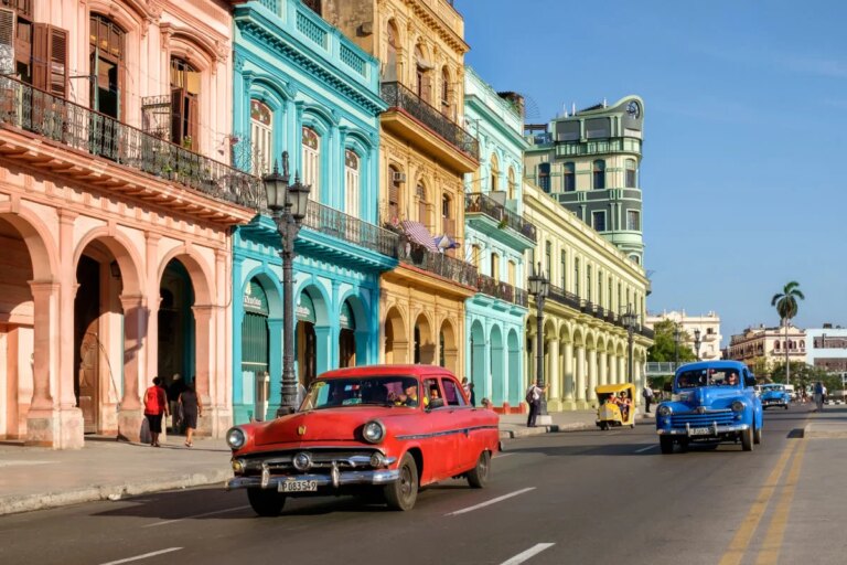 HAVANA,CUBA - Street scene with colorful buildings and old american car in downtown Havana